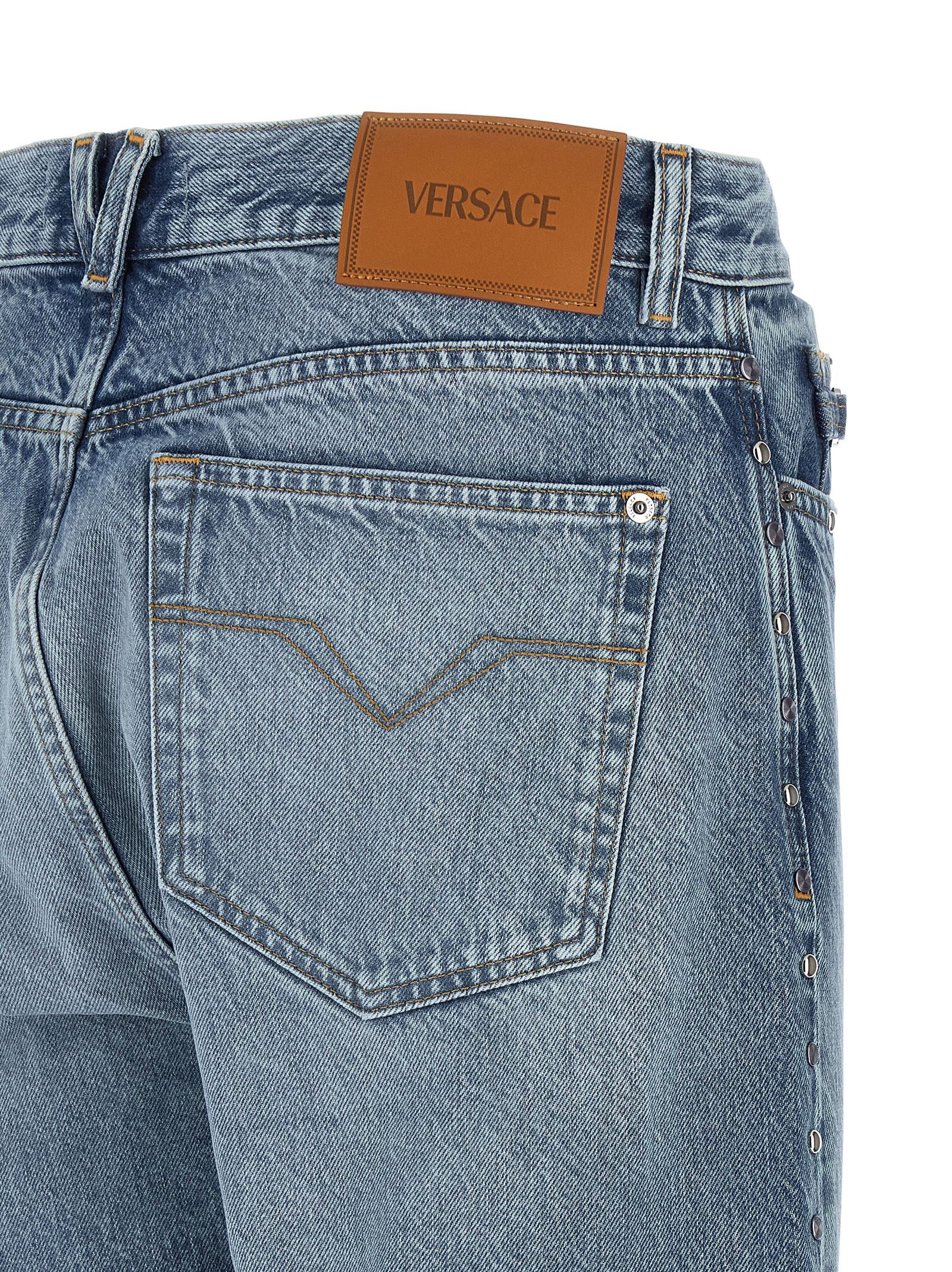 Jeans by Versace for men in denim cotton blue features an sartorial straight-leg and long with a cut for a sartorial finish.