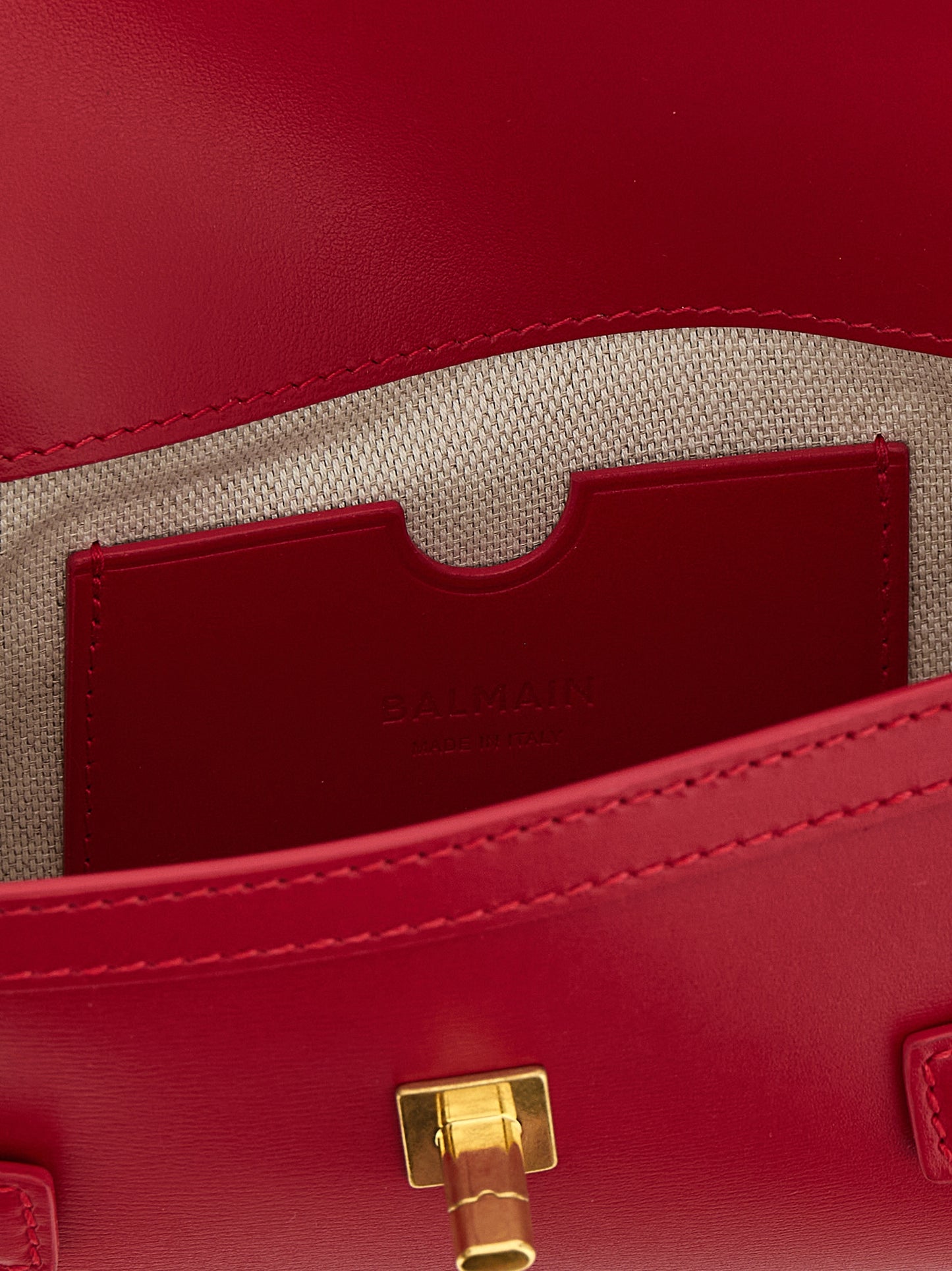 Clutch Handbag by Balmain for women in calfskin leather fuchsia features a statuesque silhouette, showcasing a secure and organized with versatile shoulder-strap for statuesque evening wear.