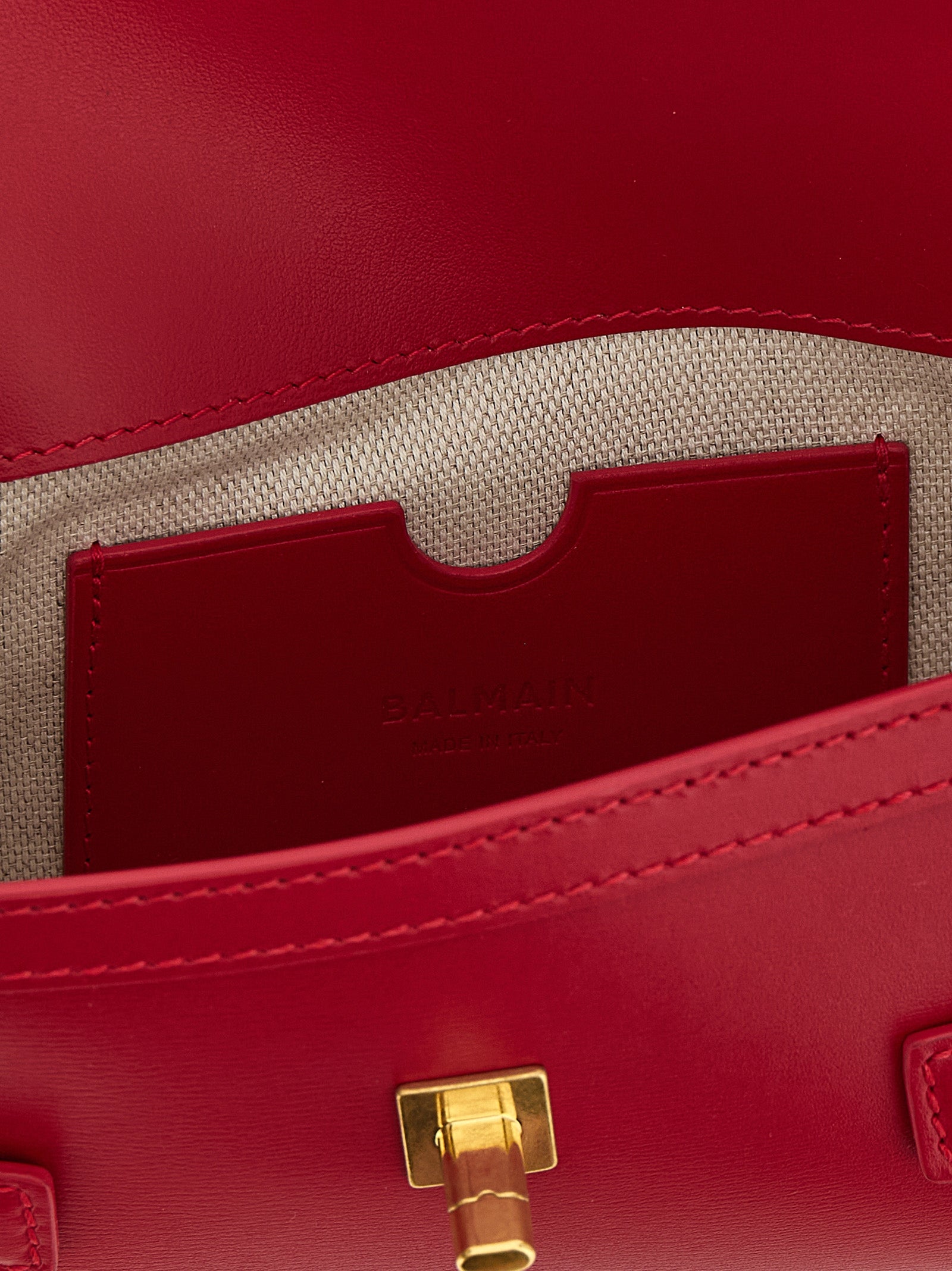 Clutch Handbag by Balmain for women in calfskin leather fuchsia features a statuesque silhouette, showcasing a secure and organized with versatile shoulder-strap for statuesque evening wear.