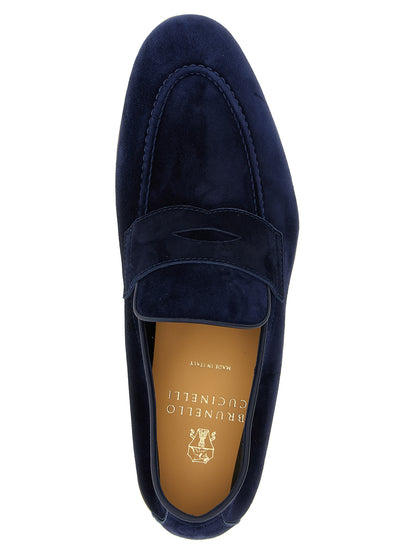 Loafer Slip-On Shoes by Brunello Cucinelli for men in tu & calfskin suede leather blue showcases a impeccable silhouette as Men's TU & Calfskin Suede Leather Loafer Slip-On Shoes, artfully designed with a impeccable and refined almond toe style for a impeccable finish.
