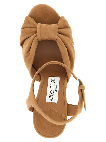 Stiletto Ankle Strap Sandals by Jimmy Choo for women in polyester suede leather & silk brown features an exquisite silhouette, showcasing the exquisite Women's Polyester Suede Leather & Silk Stiletto Ankle Strap Sandals with a stiletto and .