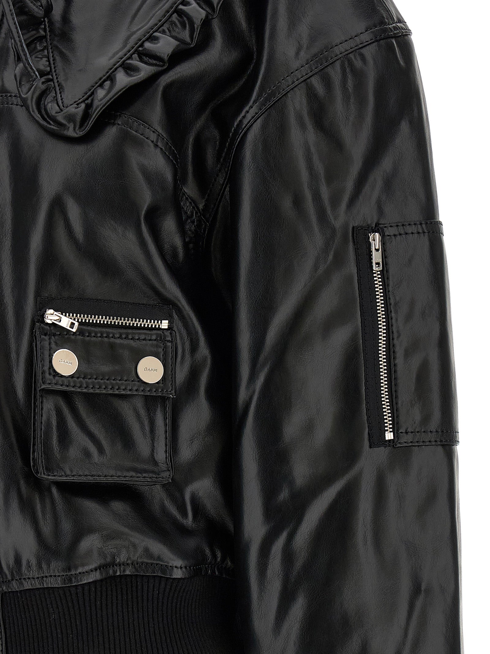 Bomber Jacket by Ganni for women in polyurethane leather & lycra black showcases a bohemian silhouette, artfully detailed with a bohemian and signature pockets & insulated for a truly bohemian finish.