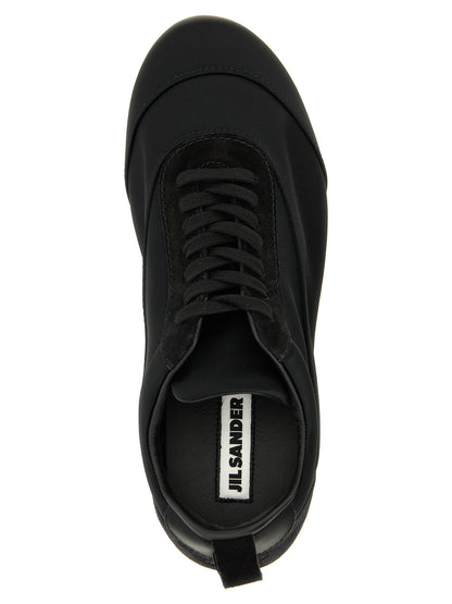 Sneakers by Jil Sander for women in cotton satin polyamide suede leather black presents a on trend silhouette from the Women's Low Top Cotton Satin Polyamide Suede Leather Sneakers collection, showcasing a on trend low-top style for an elevated aesthetic.