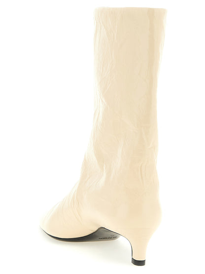 Ankle Boots by Jil Sander for women in calfskin leather beige features an high-performance silhouette, showcasing the sophisticated design of the Women's Calfskin Leather Ankle Boots with a and a refined pointed toe style.