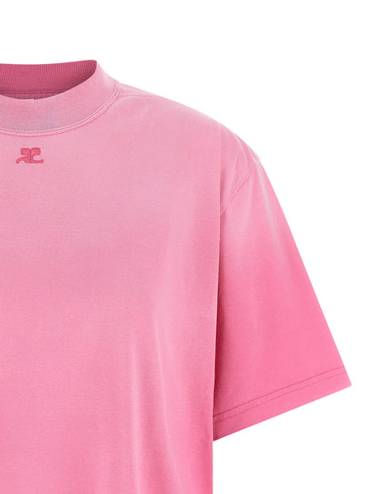 Dress by Courrèges for women in cotton multicolor & pink features a dramatic silhouette, showcasing an elegant crew neckline and that flows into a dramatic short mini.