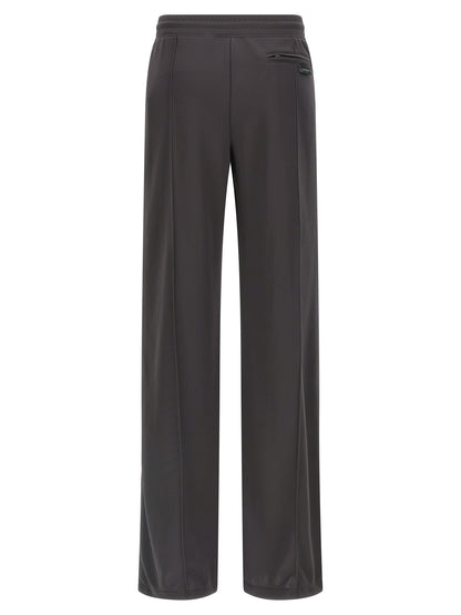 Joggers by Courrèges for women in polyester gray features an sartorial flared & wide and long with a cut for a sartorial finish.
