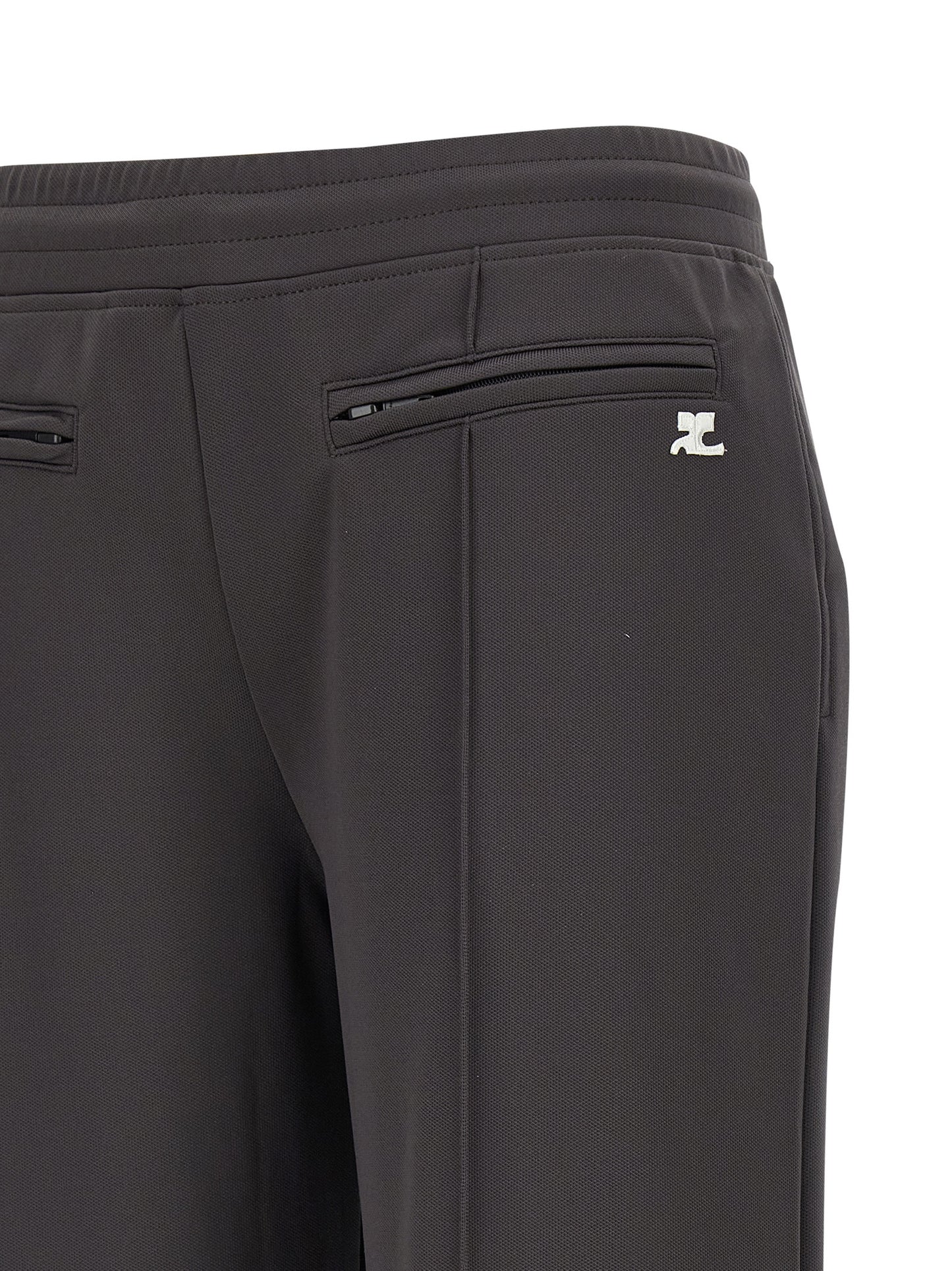 Joggers by Courrèges for women in polyester gray features a polished silhouette with a polished flared & wide, reaching a polished long and finished with a polished .
