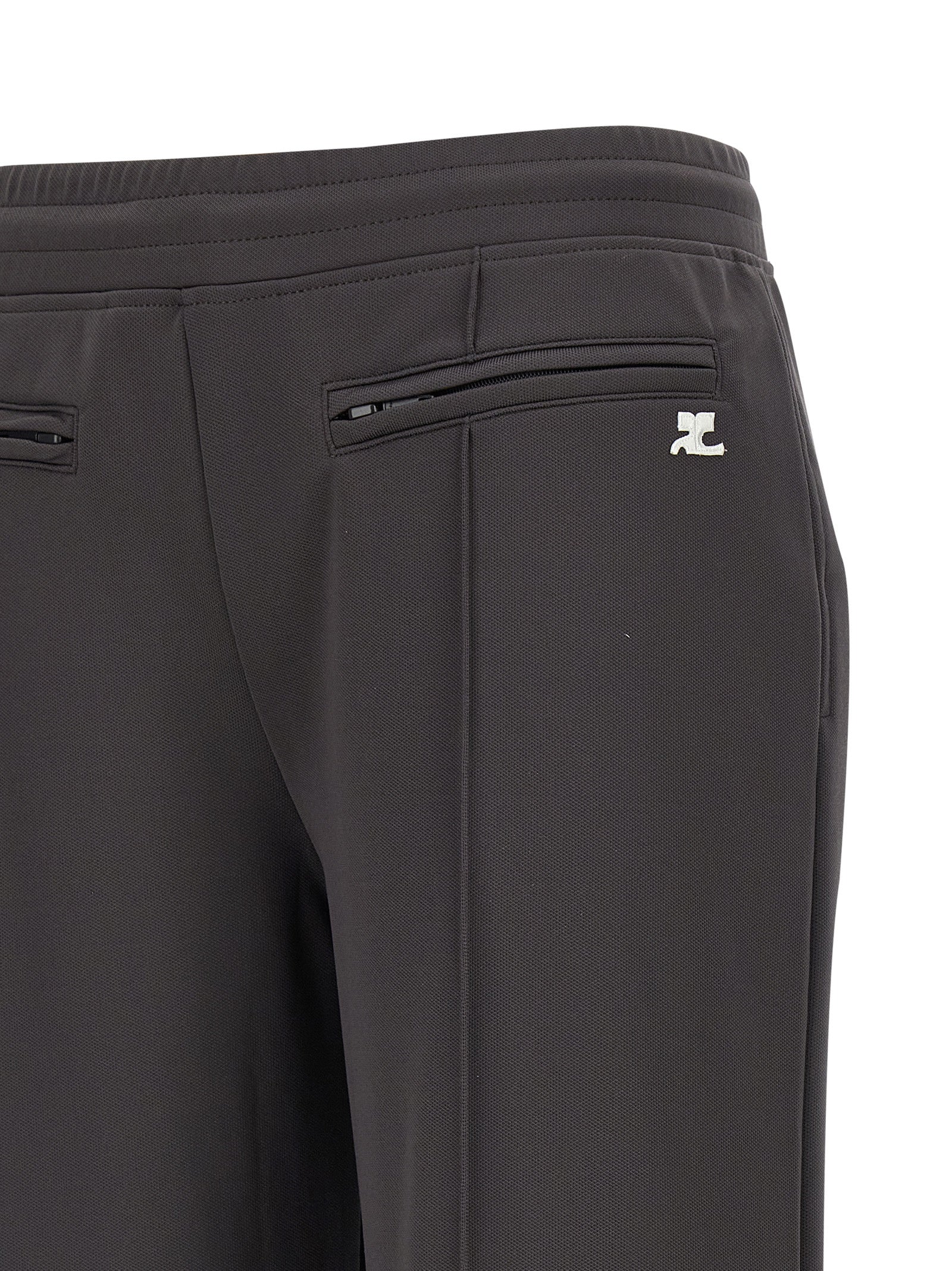 Joggers by Courrèges for women in polyester gray features a polished silhouette with a polished flared & wide, reaching a polished long and finished with a polished .