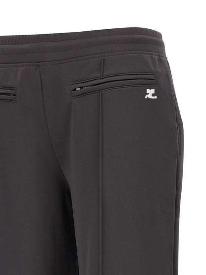 Joggers by Courrèges for women in polyester gray features a polished silhouette with a polished flared & wide, reaching a polished long and finished with a polished .