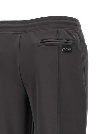 Joggers by Courrèges for women in polyester gray features an refined tailoring silhouette, showcasing a premium flared & wide with a and long cut for a refined tailoring look.