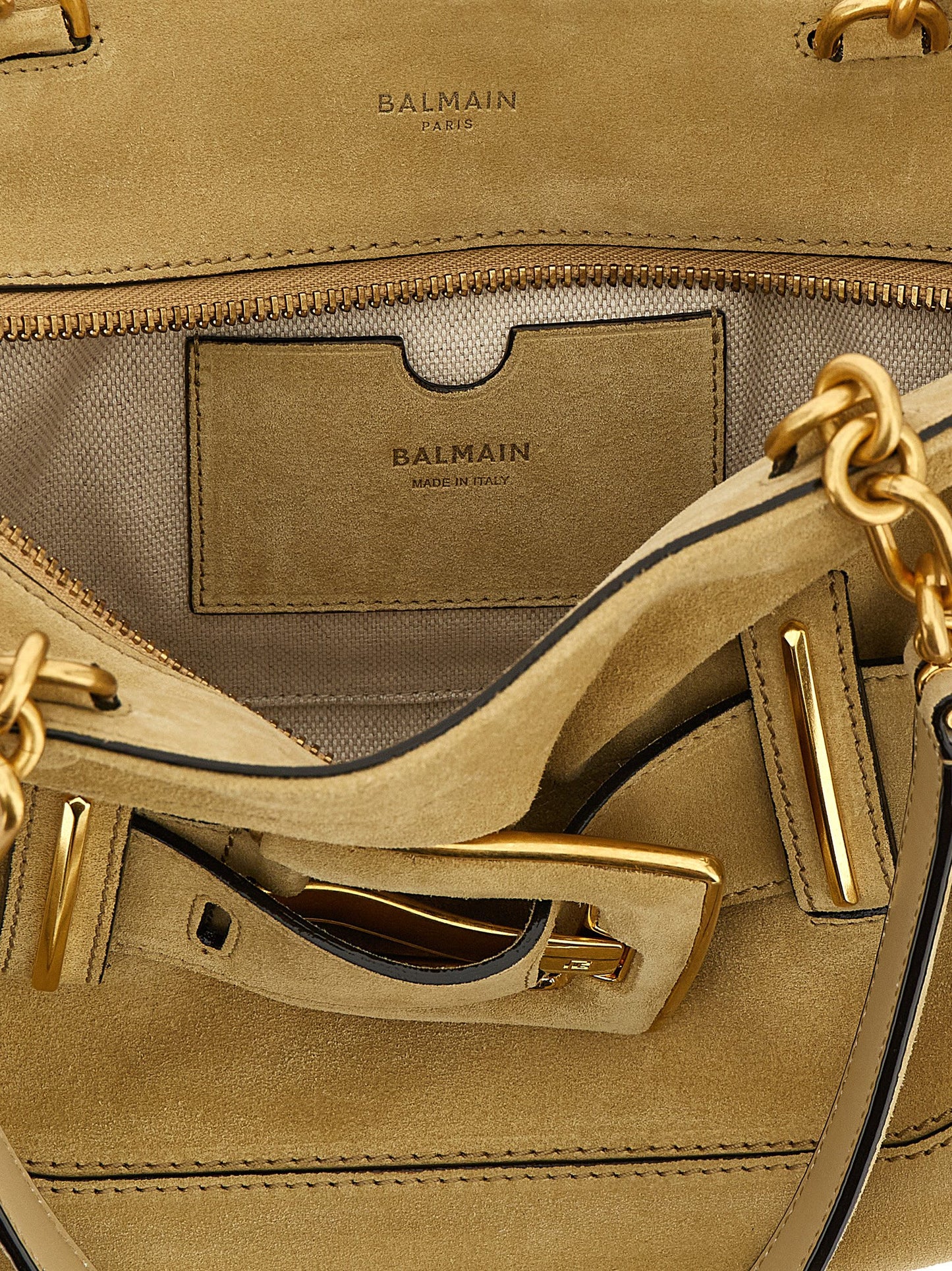 Shoulder Bag by Balmain for women in suede calfskin leather beige & signature features a effortless chic silhouette with a secure zipper & buckle, ample , and versatile shoulder-strap, belt-strap & handle for a effortless chic finish.