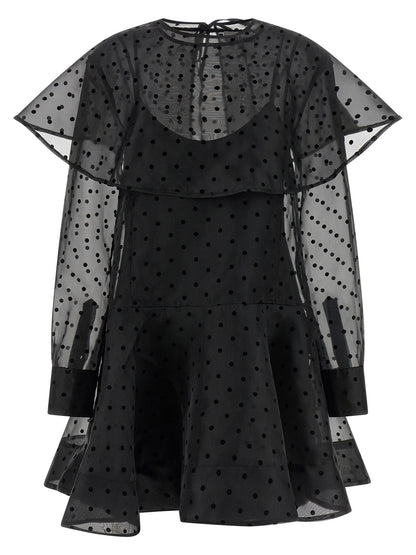 Dress by Ganni for women in polyester & viscose black & transparent features an cute silhouette, detailed with a and that elegantly flows into a cute maxi short mini.