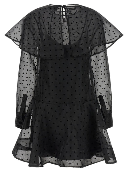 Dress by Ganni for women in polyester & viscose black & transparent showcases a striking silhouette, elegantly detailed with a , refined , and a striking maxi short mini for a striking finish.