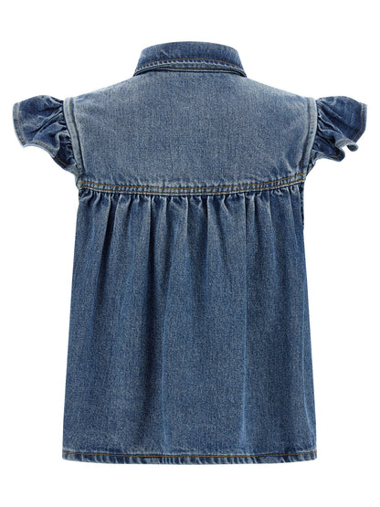 Shirt by Ganni for women in lyocell denim blue showcases a sublime silhouette, artfully detailed with a sublime shirt-collar neckline and for a sophisticated, sublime finish.