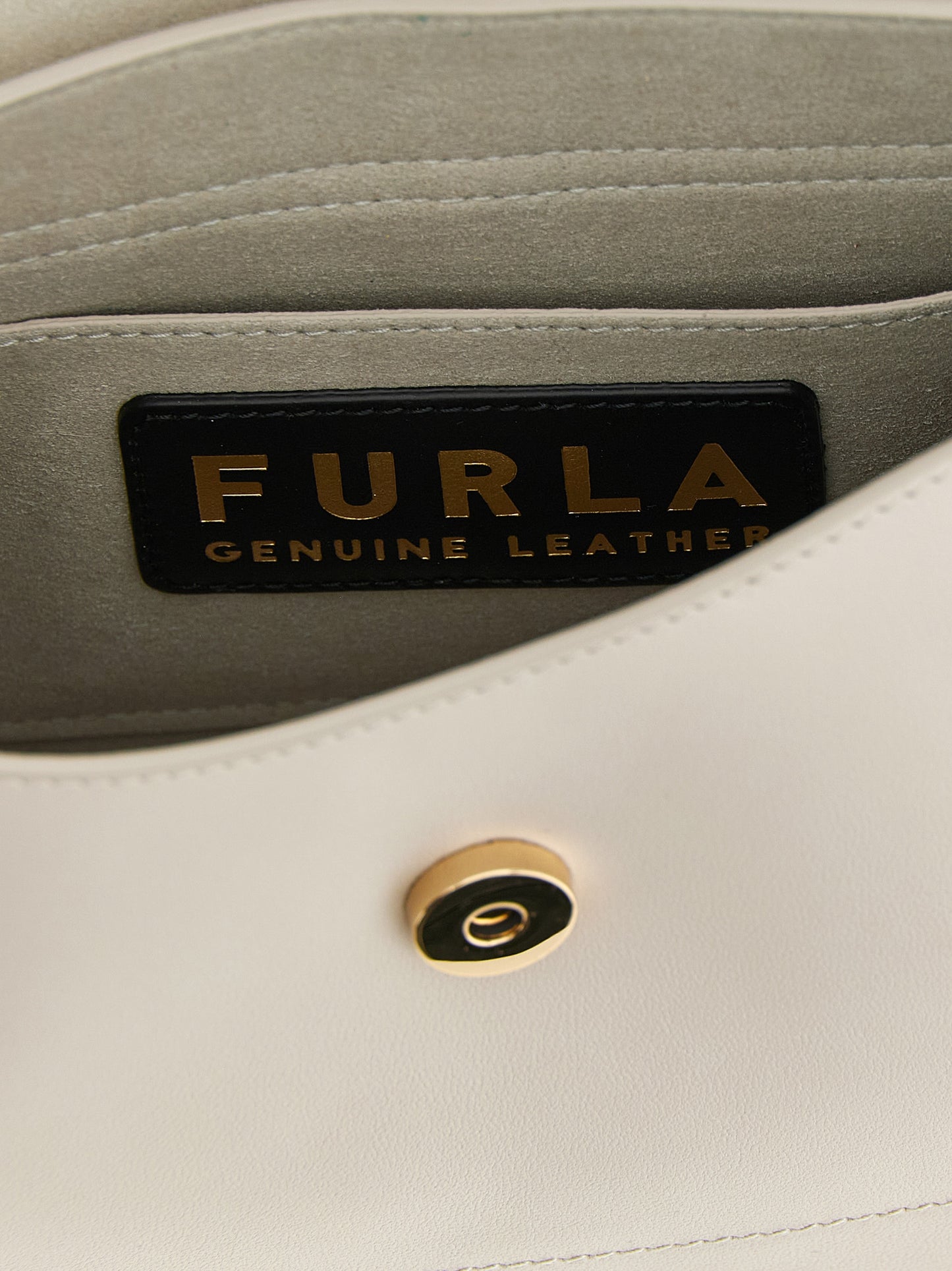 Shoulder Sling Flap Bag by Furla for women in calfskin leather beige features a statuesque silhouette, showcasing a secure flap and statuesque with versatile shoulder-strap, adjustable-strap & handle for a statuesque finish.