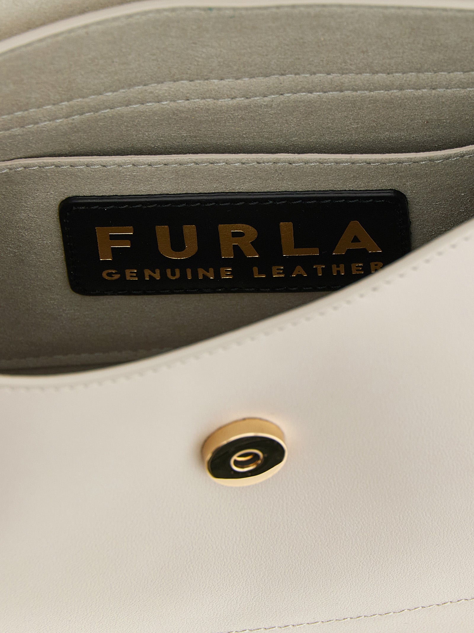Shoulder Sling Flap Bag by Furla for women in calfskin leather beige features a statuesque silhouette, showcasing a secure flap and statuesque with versatile shoulder-strap, adjustable-strap & handle for a statuesque finish.