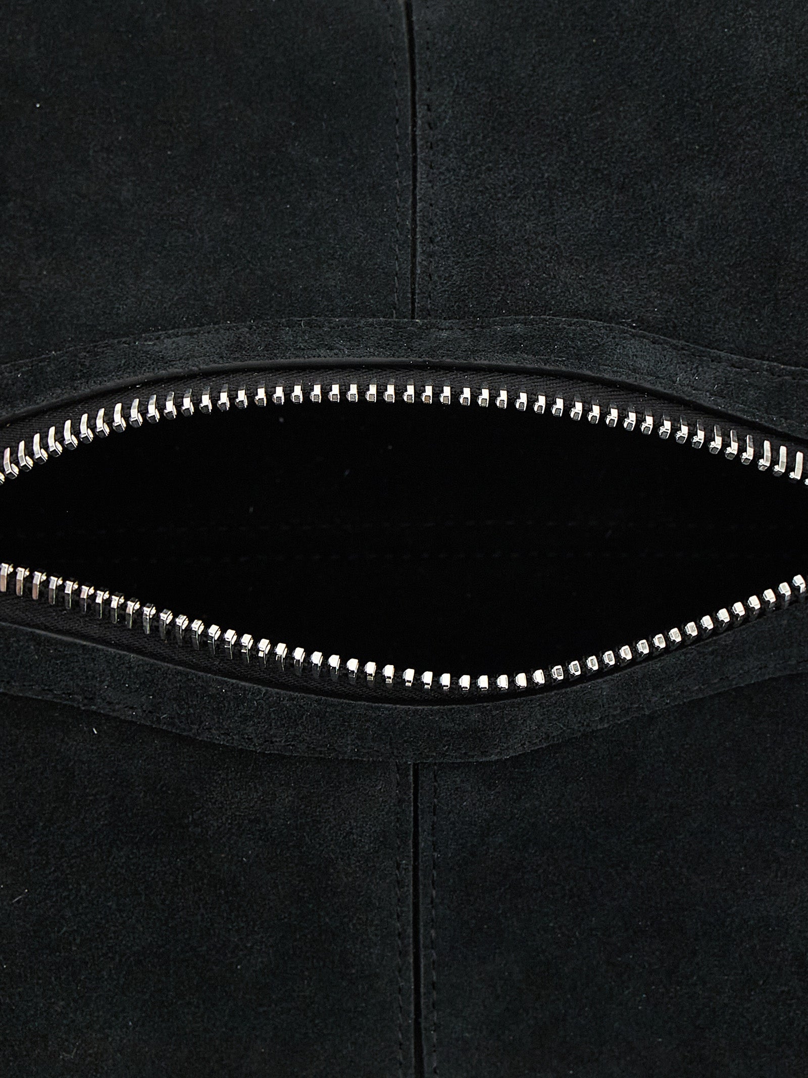 This Mini Handbag by Coperni for women in bos taurus calf suede leather and black presents a sculptural silhouette featuring a secure zipper, ample , and versatile handle for a sculptural finish.