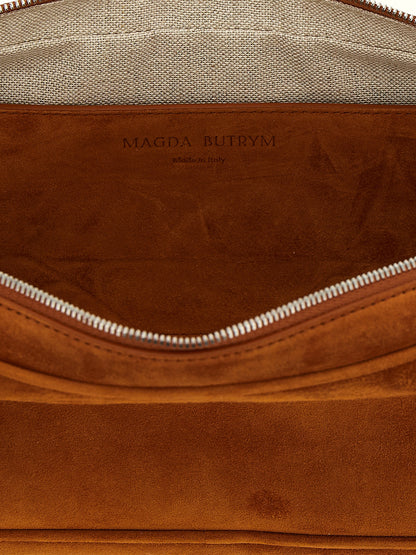 Shoulder Trapeze Bag by Magda Butrym for women in suede calfskin leather brown, rose & signature showcases a enviable silhouette, artfully detailed with a secure zipper, organized , and versatile shoulder-strap & handle for a enviable look.