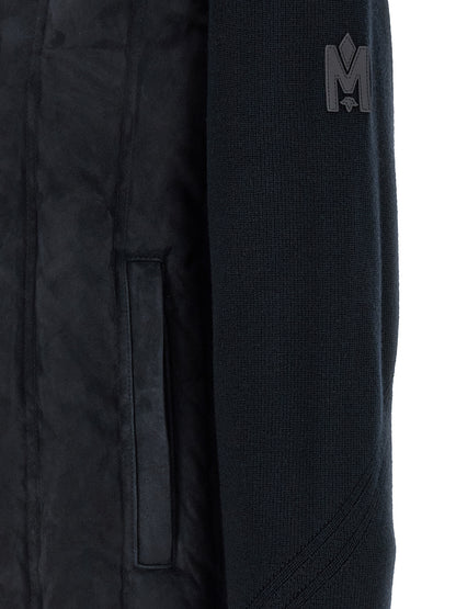 Overcoat by Mackage for men in virgin wool & suede leather blue features a cosy chic silhouette, artfully detailed with a sophisticated and premium pockets & insulated for a cosy chic finish.