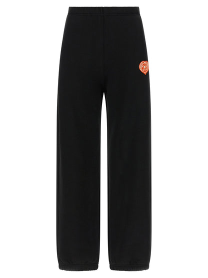 Joggers by Kenzo for women in cotton black presents a tailored silhouette, showcasing a tailored straight-leg and long cut with a refined for a truly tailored aesthetic.