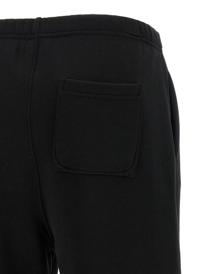 Joggers by Kenzo for women in cotton black features a refined silhouette with a refined straight-leg, defined by a and a refined long for a refined finish.