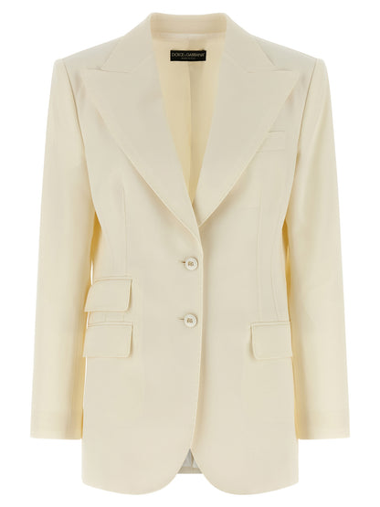 This Blazer by Dolce & Gabbana for women in virgin wool white presents a tailored silhouette, meticulously tailored with a tailored and distinctive for a tailored finish.