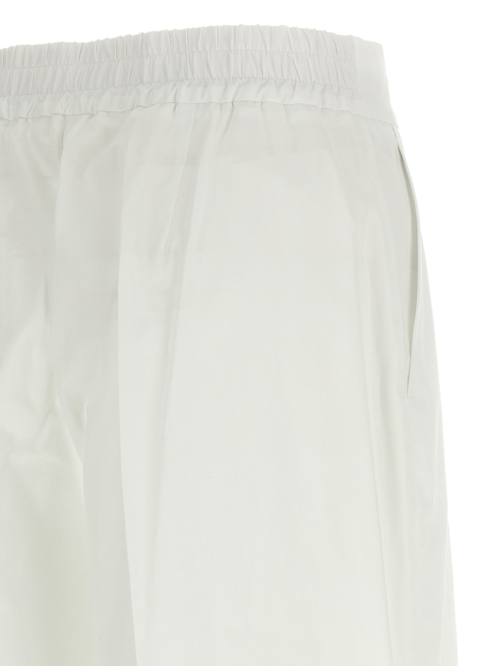 Trousers by P.A.R.O.S.H. for women in cotton white features an sartorial silhouette, showcasing a precise straight-leg & wide and long with a sartorial for a refined look.