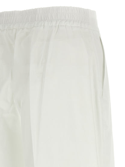 Trousers by P.A.R.O.S.H. for women in cotton white features an sartorial silhouette, showcasing a precise straight-leg & wide and long with a sartorial for a refined look.