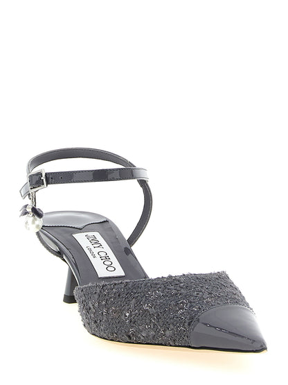 This Mid-Heel Ankle Strap Slingback Pumps Heels by Jimmy Choo for women in patent leather gray & pearl presents a effortlessly chic silhouette from the Women's Patent Leather Mid-Heel Ankle Strap Slingback Pumps Heels collection, featuring a effortlessly chic mid-heel and effortlessly chic pointed toe style.