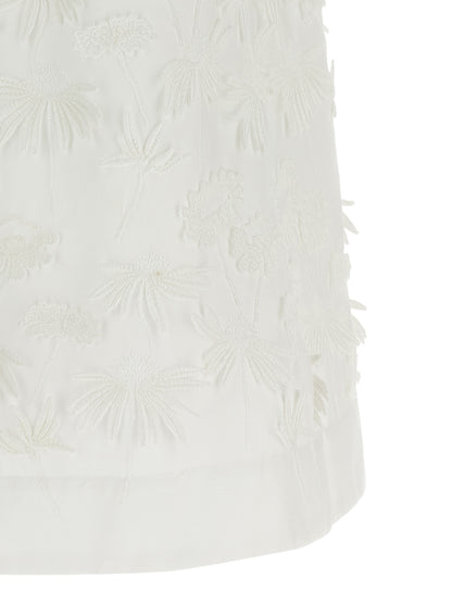 Blouse by P.A.R.O.S.H. for women in cotton white & floral showcases a sublime silhouette, artfully detailed with a sublime and for a sophisticated, sublime finish.