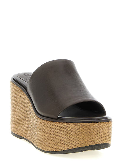 Wedge Sandals by Brunello Cucinelli for women in raffia & calfskin leather brown features an architectural design from the Essence Heart Women's Raffia & Calfskin Leather Wedge Sandals collection, defined by a architectural wedge and for a architectural finish.