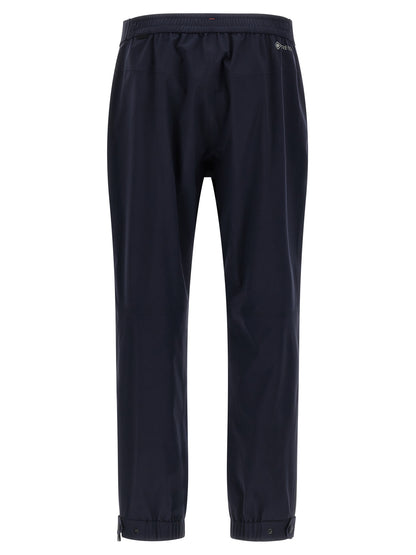 Joggers by Moncler Grenoble for men in polyamide blue features an refined tailoring silhouette, showcasing a premium with a and long cut for a refined tailoring look.