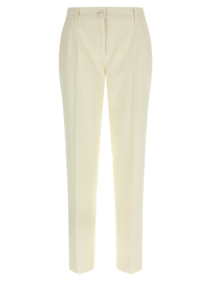 Trousers by Dolce & Gabbana for women in virgin wool white features a sculptural silhouette, showcasing a sculptural straight-leg and long with a sophisticated for a sculptural finish.
