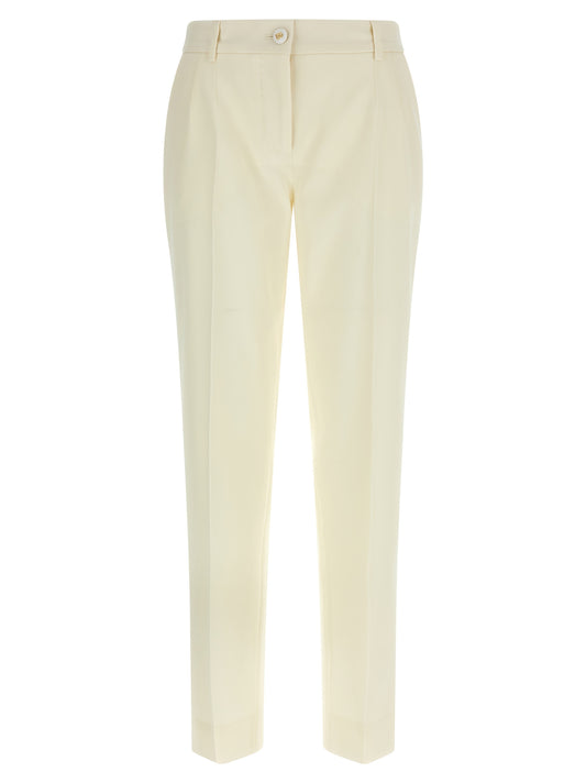 Trousers by Dolce & Gabbana for women in virgin wool white features a sculptural silhouette, showcasing a sculptural straight-leg and long with a sophisticated for a sculptural finish.