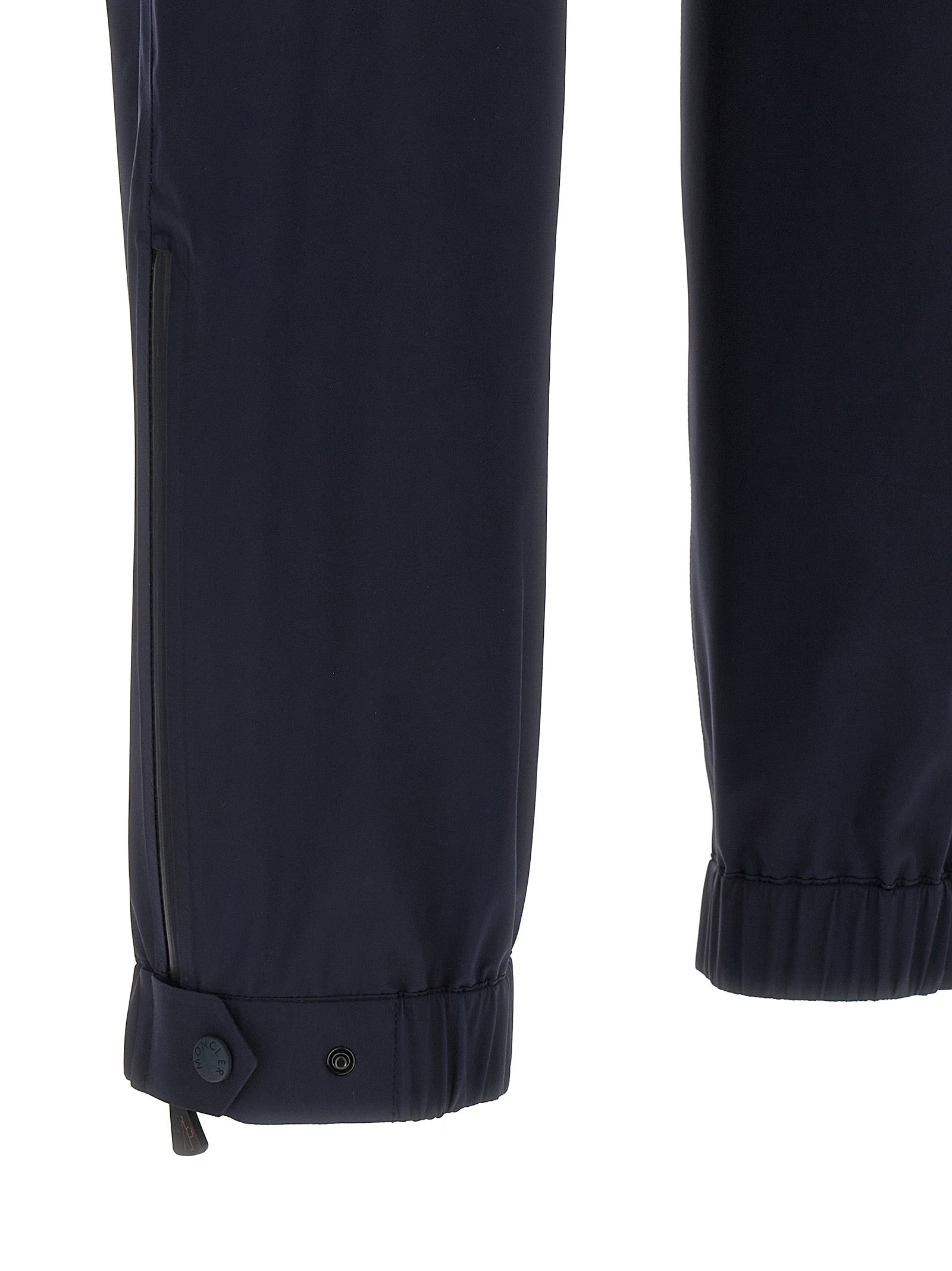 Joggers by Moncler Grenoble for men in polyamide blue features an sartorial and long with a cut for a sartorial finish.
