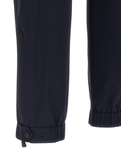 Joggers by Moncler Grenoble for men in polyamide blue features an sartorial and long with a cut for a sartorial finish.