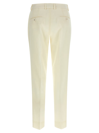 Trousers by Dolce & Gabbana for women in virgin wool white features a tailored silhouette with a tailored straight-leg, defined by its long and a sophisticated .