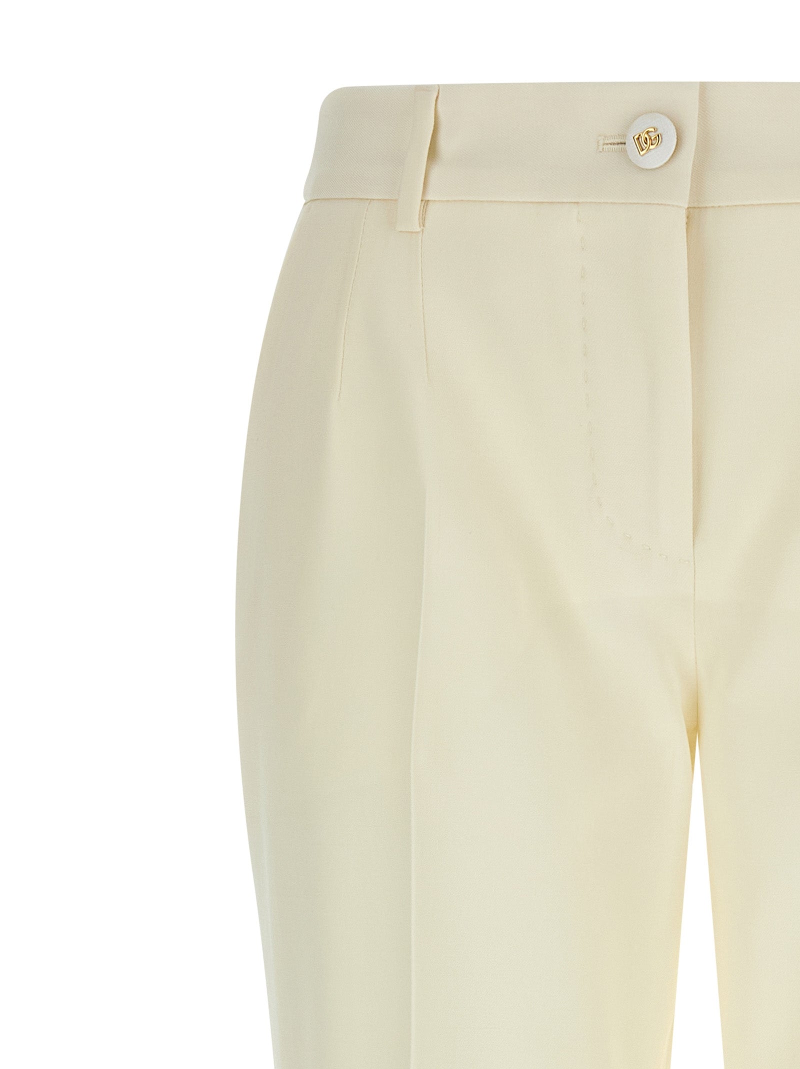 Trousers by Dolce & Gabbana for women in virgin wool white presents a perennial silhouette, meticulously tailored with a straight-leg cut, long finish, and an elegant .