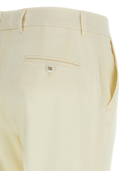 Trousers by Dolce & Gabbana for women in virgin wool white features an sartorial silhouette, showcasing a precise straight-leg and long with a sartorial for a refined look.