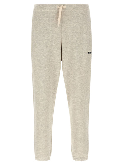 Joggers by Autry for men in cotton polyester gray presents a refined pantology silhouette, artfully defined by a refined pantology straight-leg, long, and a sophisticated .