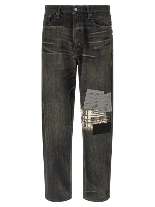 Jeans by Yohji Yamamoto for men in denim cotton black & jacquard features a refined silhouette with a refined tapered-leg, defined by a mid rise and a refined long for a refined finish.