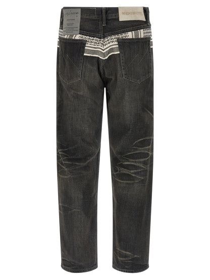 Jeans by Yohji Yamamoto for men in denim cotton black & jacquard features a polished silhouette with a polished tapered-leg, reaching a polished long and finished with a polished mid rise.