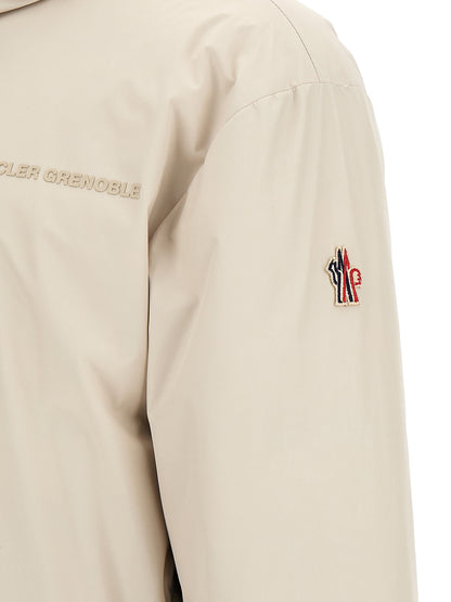 Hooded Puffer Jacket by Moncler Grenoble for men in nylon beige features an contemporary silhouette, showcasing a sophisticated and contemporary hooded, insulated & windproof for a truly refined look.