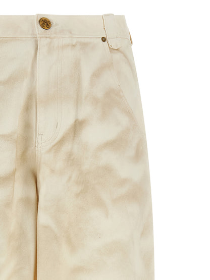 Jeans by WILLY CHAVARRIA for men in denim cotton beige features a polished silhouette with a polished tapered-leg, reaching a polished long and finished with a polished high rise.
