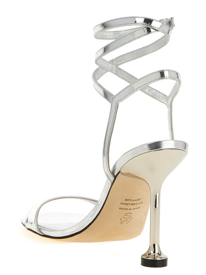 Stiletto Ankle Strap Sandals by Stuart Weitzman for women in polyethylene polyurethane leather silver presents a sculptural silhouette, showcasing the Women's Polyethylene Polyurethane Leather Stiletto Ankle Strap Sandals design with a sculptural stiletto and for a premium look.
