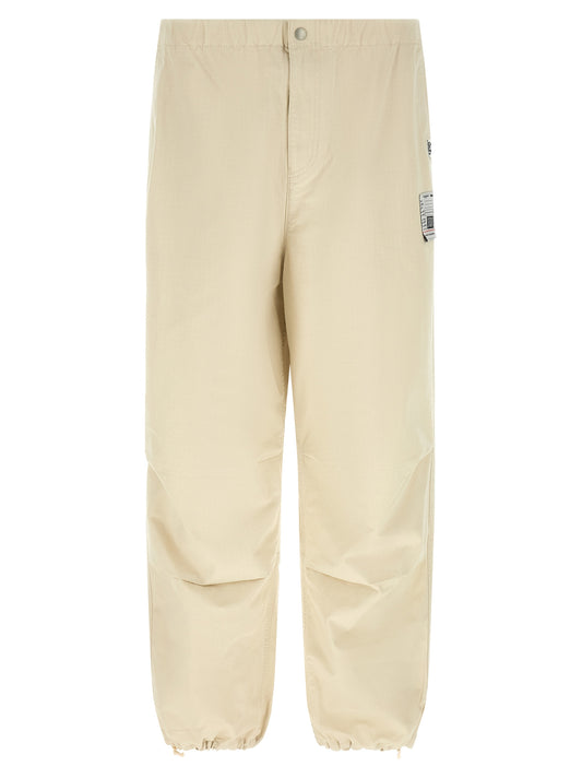 Activewear Pants by Maison Mihara Yasuhiro for men in cotton beige features an contemporary tapered-leg, athletic & wide with a long and , showcasing for a contemporary finish.