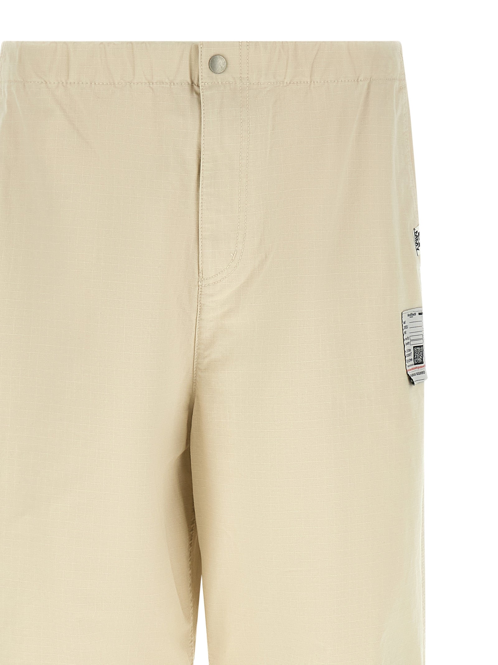 Activewear Pants by Maison Mihara Yasuhiro for men in cotton beige features an sporty tapered-leg, athletic & wide with a long and , expertly finished with for an sporty performance aesthetic.