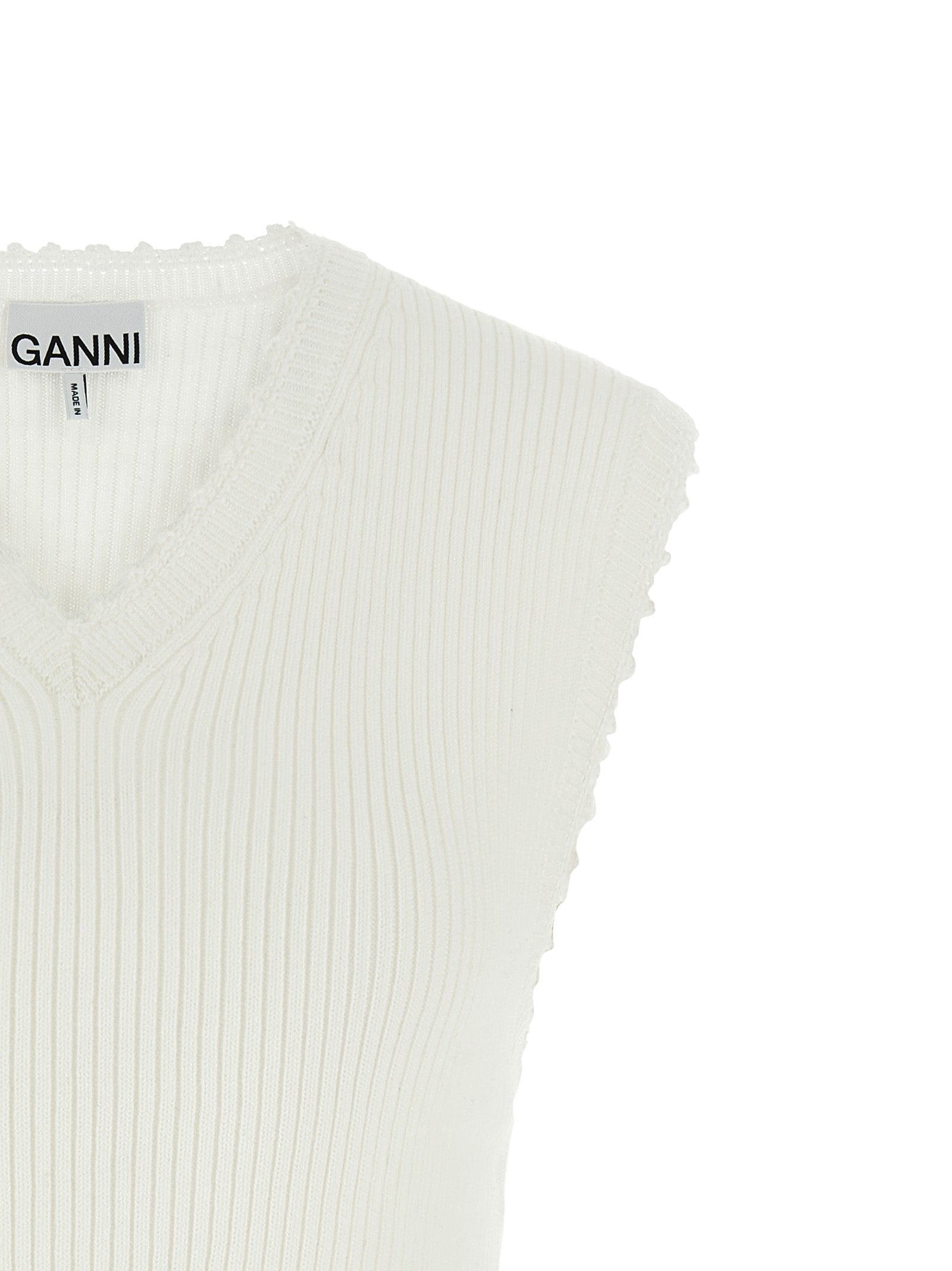 Vest by Ganni for women in organic cotton & polyamide white showcases a utilitarian silhouette, artfully incorporating and a utilitarian v-neck neckline for a truly utilitarian finish.