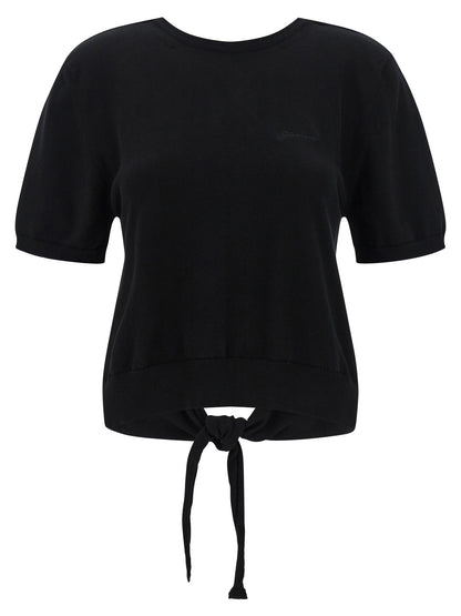 Cardigan by Ganni for women in organic cotton black showcases a luxurious silhouette, meticulously detailed with a sophisticated and short-sleeve for a refined finish.