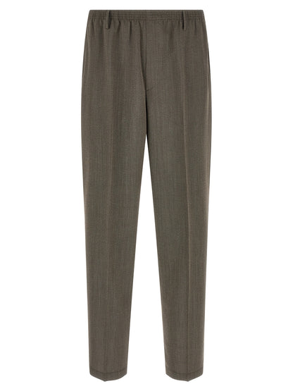 Trousers by CELLAR DOOR for men in virgin wool brown presents a perennial silhouette, meticulously tailored with a tapered-leg & wide cut, long finish, and an elegant .